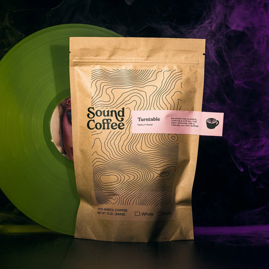 Sound Coffee Turntable medium roast coffee bag with green vinyl record, smoky background