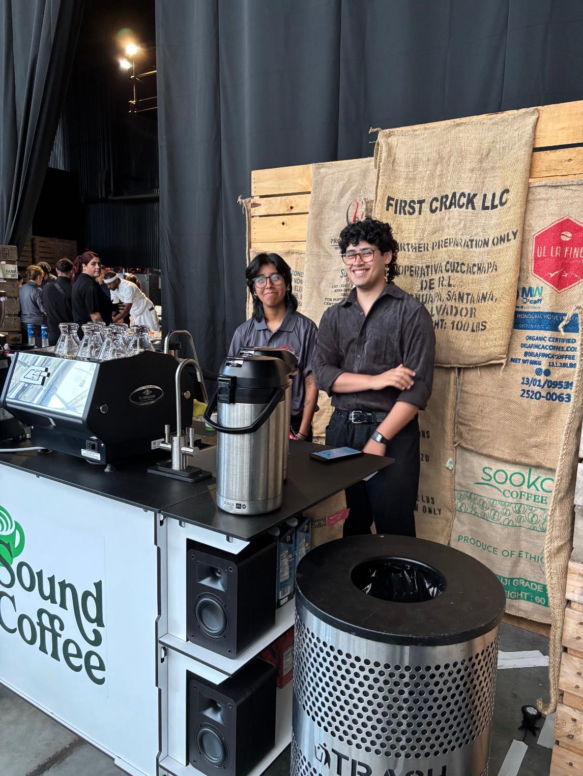 Sound Coffee baristas at mobile espresso bar with specialty coffee bags at catered event