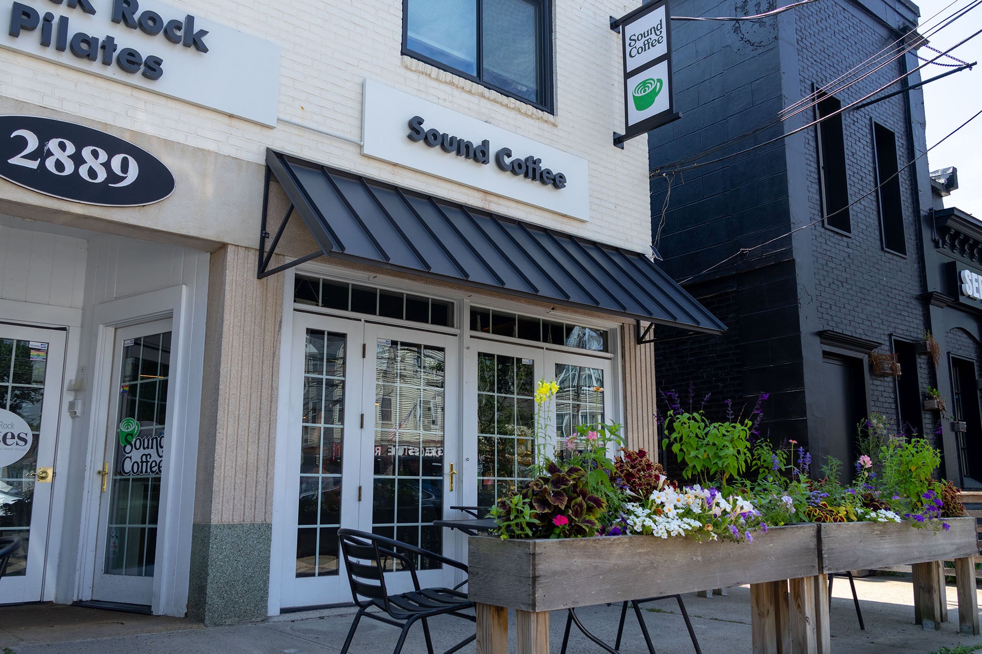 Sound Coffee cafe storefront at 2889 Fairfield Ave Bridgeport CT with outdoor seating and flower boxes