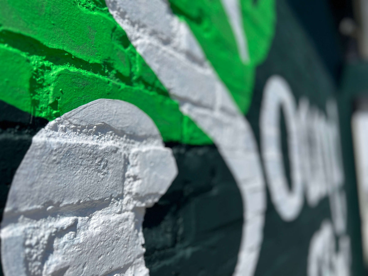 Closeup shot of the Sound Coffee logo painting on the wall