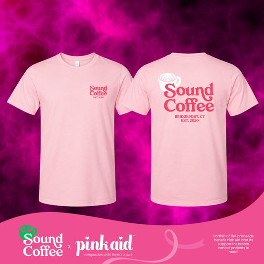 Two light pink t-shirts shown front and back with red 'Sound Coffee' graphics, displayed on a vivid pink smoky background with a pink brand banner at the bottom.